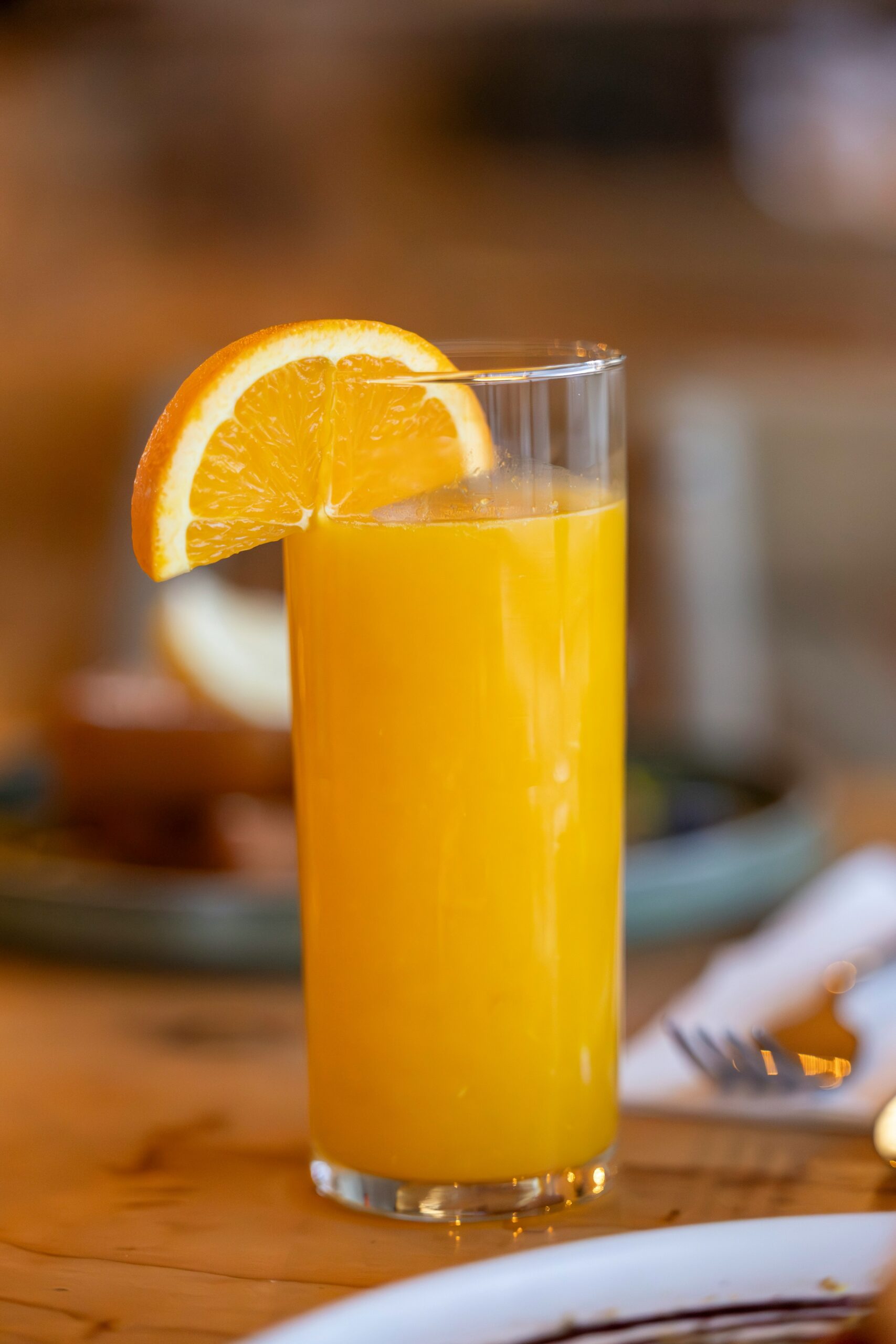 A glass of orange juice in a restaurant