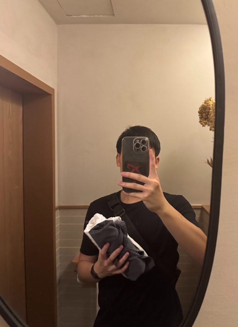 Picture of myself in in the mirror changing out of work clothes at a restaurant